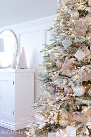 A Snowy Flocked Christmas Tree Nick Alicia Flocked Christmas Trees Decorated Gold Christmas Decorations Rose Gold Christmas Decorations