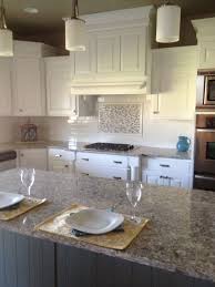Beautiful Kitchen With White Subway Tiles As A Backsplash With An Accent Above Stove Trendy Kitchen Backsplash White Subway Tile Backsplash Metallic Backsplash