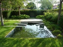 The Dark Mirror A Backyard Reflecting Pool In Eastern Europe Gardenista Fountains Backyard Garden Design Backyard