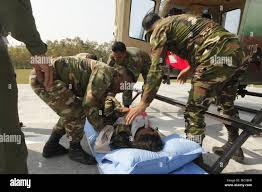 Bangladesh Army Soldiers practice unloading a simulated casualty from a  helicopter as part of a simulated mass casualty training event as part of  Exercise Shanti Doot 4 in Bangladesh. Shanti Doot 4