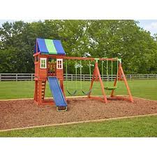 A slide, a swing, a rock wall and a platform gives children plenty to do. Swing Sets Playsets Playgrounds Academy