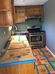 Take a clean rag, pour some deglosser on it, and rub it on the kitchen cabinet surfaces you would like to degloss. How To Refinish Kitchen Cabinets Part 1 Frugalwoods