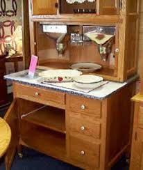 This small flour bin has hinges to attach it to the underside of the top of the cabinet. Amish Peddler Custom Handcrafted Amish Furniture