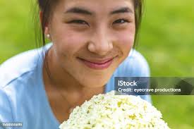 Girl Hand Holding A Flower Garland With Jasmine Stock Photo
