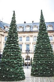 Instead of putting up ornamental christmas decorations on the trees, often red ribbons are used for decorating the trees. Christmas In Paris Where To Eat What To See Do A Hedgehog In The Kitchen