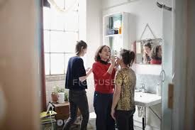 6 i was thinking about him when he _ (ring) me! Young Women Friends Getting Ready Applying Makeup In Bathroom People Indoors Stock Photo 221324280