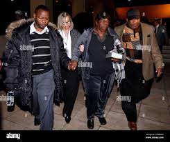 Edna Glover, mother of Henry Glover, second from the right, reacts outside  federal court in New Orleans, Wednesday, Dec. 11, 2013. A federal jury  acquitted a former New Orleans police officer of