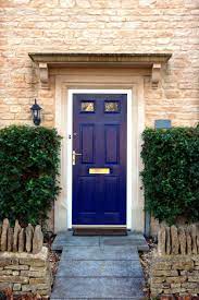 A beautiful porch in a rich house with black door, red brick wall and white flower pots. Front Door Colors For Yellow Brick House Front Door Ideas This Home Has A Stone Front Exterior It Has Painted Front Doors Yellow Brick Houses Best Front Doors