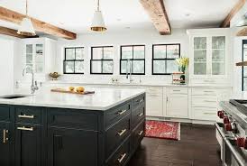 Stunning Black And White Kitchen Is Accented With Rustic Wood Ceiling Beams And Goodman Hanging Kitchen Remodel Small White Kitchen Remodeling Kitchen Remodel