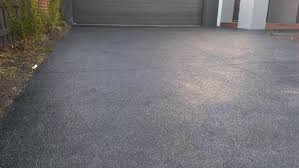 Exposed aggregate driveway vs concrete. Black Exposed Aggregate With A Bit Of White Stone Through It Exposed Aggregate Driveway Exposed Aggregate Exposed Aggregate Concrete