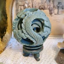 Chinese puzzle spheres (right) are carved from a single piece of ivory or stone. Chinese Jade Puzzle Ball Vintage Recycled