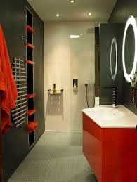 A refined black and gold bathroom with a chic ornate mirror, wall sconces, a black vanity and a white sink. 16 Most Fabulous Red And Black Bathroom Decor Ideas To Get Inspired Jimenezphoto