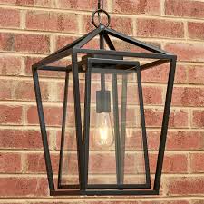 Outdoor wall lantern with dusk to dawn photocell, matte black porch lights exterior wall lighting. Modern Obelisk Outdoor Pendant Large Outdoor Hanging Lights Modern Outdoor Pendant Light Hanging Porch Lights