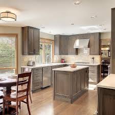 Gorgeous Warm Gray Stained Kitchen Cabinets With Stainless Appliances Stained Kitchen Cabinets Kitchen Cabinet Design Grey Kitchen