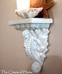 You can also arrange a grouping of sea treasures. Wall Sconce Shelves To Display Collections Coastal Decor Ideas Interior Design Diy Shopping