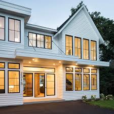 A combination of casement and picture windows with white interiors create a bright and airy office space. Black Windows For All Home Styles