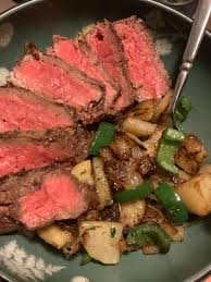Looking to cook with bison? Bison Sirloin Steak Potatoes Onions And Jalapenos Cooked With Rosemary Thyme And Garlic Foodporn