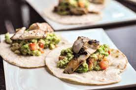 The sweet and tangy slaw in these ridiculously fast tacos tastes amazing with simply seared, crispy chunks of fish. Sea Bass Tacos Kitchenmess