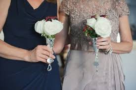 Brides shop the collections and order. Mothers Of The Bride Groom Carry Pretty Petite Nosegays Comprised Of White Roses Purple Mini Call Mother Of The Bride Bouquets Bride Flowers Bride Floral