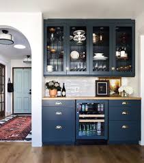 For entertaining, a stylish bar cabinet is a perfect addition to your dining room, living room or den. Navy Kitchen With A Stunning Built In Home Bar Cabinet Crockery Cabinet Design Crockery Unit Design