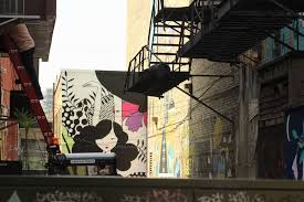 And managed by wallpapered.city, it's. Some Cool New Murals Are Coming To Black Cat Alley