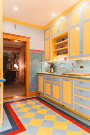 Patterned wallpaper and vibrant cabinets. Depression Era Art Deco Style Inspires A Chicago Kitchen