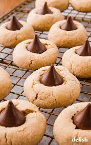 Peanut Butter Blossoms Are The Best Cookies You Ll Make This Year Recipe Peanut Butter Blossoms Recipe Holiday Baking Cookies Recipes Christmas