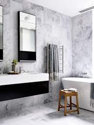 This clever mirror image eclipse of the double mirror on this beautiful marble tiled wall creates a very cool feature in this gorgeous vanity area. Black White Shower Room Designs