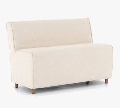 You can certainly leave the nailhead trim off and fold the fabric back on itself and staple again. Loomis Upholstered Dining Bench Pottery Barn