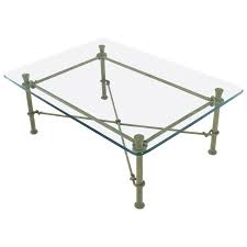 It flaunts a clear, tempered glass top and forged iron frame with subtle rings and curves finished in rustic bronze patina. Rectangle Wrought Iron Base Glass Top Coffee Table For Sale At 1stdibs