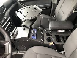 I've had people in mine who were shocked to find out my 'console' folded up and allowed an extra seat! Troy Products Police Interceptor Utility Public Safety Products