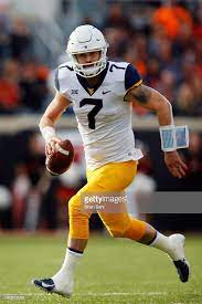 Quarterback Will Grier Of The West Virginia Mountaineers Runs As He Wvu Football College Football Uniforms West Virginia Mountaineer