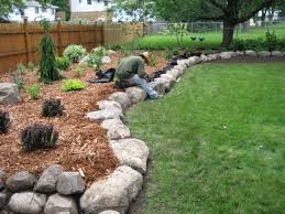 The first step is to mow and bag your lawn, then you can begin dethatching. Fieldstone Boulder Wall Planting Bed Pahl S Market Apple Valley Mn Stone Landscaping Rock Garden Design Landscaping With Rocks