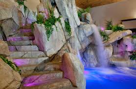 The rustic elements and feel of this swimming pool area with the slide is ravishing. Can Indoor Pools Sink Home Values Mansion Global