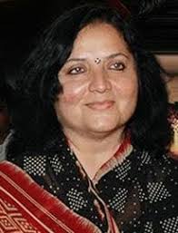 This image is a throwback family photograph of the Indian actor Mithun  Chakraborty with his wife, the former actress Yogita Bali, and their  children. The people in the photo are: Mithun Chakraborty: