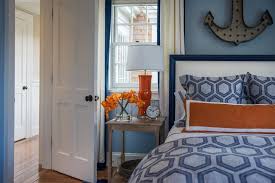 The walls are a light gray and the flooring is a brown color. 14 Ways To Decorate With Cayenne Orange Hgtv