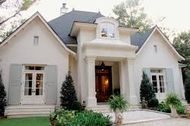 I won't keep you waiting. Charming French Country Cottage Designed By Bob Chatham Brick Exterior House Painted Brick House Brick Houses Exterior