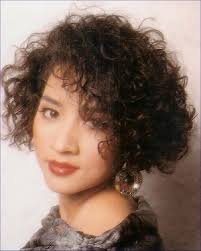 Keep your short curly hair under control and looking chic with one of these popular short curly hairstyles! Asian Short Hair Style With Small Curls Black