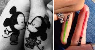 Hook tattoo with feather for couple. 87 Matching Couple Tattoos For Lovers That Will Grow Old Together Bored Panda