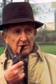 J.R.R. Tolkien, born January 3. 1892, smoking a favorite Dunhill.