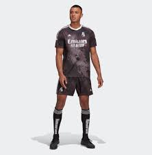 Karim benzema (real madrid) header from the centre of the box to the high centre of the goal. Real Madrid Human Race Jersey Goaljerseys
