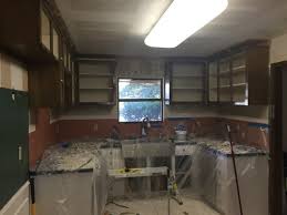 The easiest and also the quickest solution to fit kitchen cabinets on uneven wall is to simply fix one or two wooden battens that will play the role of a guideway for all cabinets. Kitchen Cabinets Uneven To Window Please Help With Ideas