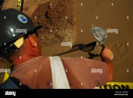 An equipment operator assigned to naval mobile construction battalion 74  hi-res stock photography and images