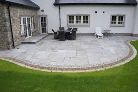 Kandla Grey Sandstone Paving With Granite Cobble Border Natural Forest Flint Pebbles Patio Stones Patio Garden Design Curved Patio