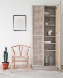 Turn an entire wall in your home office into shelf space by adding bookcases with glass doors. This Billy Celebrates With One Of A Kind Cane Doors Ikea Hackers
