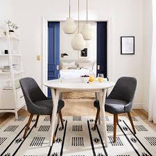 Glass shades in a milk finish. Sculptural Glass 3 Light Ribbed Chandelier Champagne