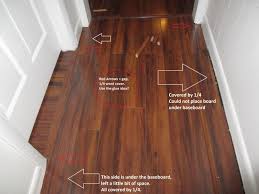 Caulking before painting, between the board and the laminate, is an ideal solution for gaps between boards. Laminate Alignment Baseboard Mistake Diy Home Improvement Forum