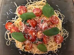 Pour the dressing over the pasta, sprinkle with the parmesan and parsley, and toss well. Ina Garten S Summer Pasta Dish With Tomatoes Is Easy To Make