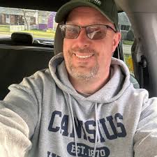 What lawn service is recommended in Tonawanda for lawn rolling and summer  maintenance?