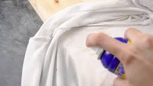 Another natural method is to soak the clothing in a bowl of vinegar, then wash the item as normal. 5 Ways To Remove Grease Or Oil Stains From Clothing Wikihow